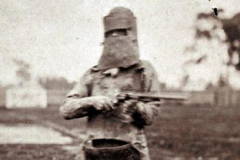 FILE - In this undated file photo released by the State Library of Victoria, Australia's most infamous criminal Ned Kelly holds a gun in Melbourne, Australia. Victoria state government officials said Thursday, Aug. 2, 2012 that Kelly's remains finally be given to his family - 132 years after he was executed. (AP Photo/State Library of Victoria, File)  EDITORIAL USE ONLY, NO SALES *** Local Caption ***  Australia Bandit's Bones.JPEG-02662.jpg