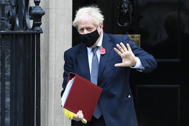 Prime Minister Boris Johnson leaves 10 Downing Street. Following the weekly Prime Minister's Questions session in the House of Commons, MPs will vote on the government's month-long lockdown in England. Getty Images