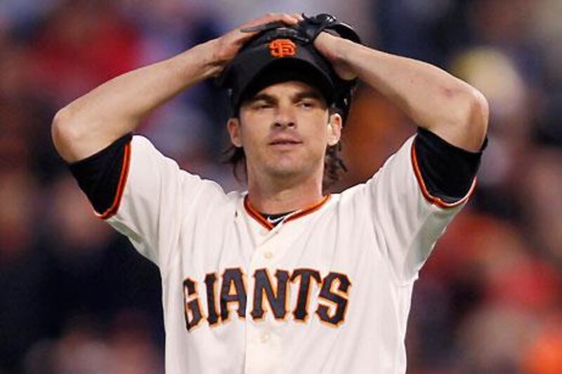San Francisco Giants' second baseman Ryan Theriot shows the strain against Washington