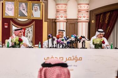 Saudi Aramco chairman Yasir Al Rumayyan, left, with Prince Abdulaziz and Aramco chief executive Amin Nasser, right in Jeddah on Tuesday. Bloomberg