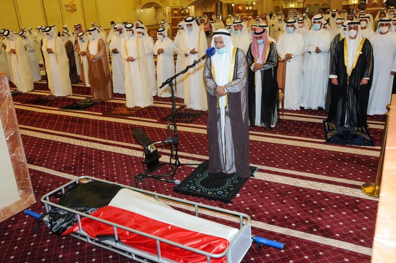 The head of the International islamic Charity Organization, Abdullah al-Maatouq, leads prayers over the body of the late emir Sheikh Sabah al-Ahmad Al-Sabah upon its arrival for burial at the Bilal bin Rabah Mosque. AFP