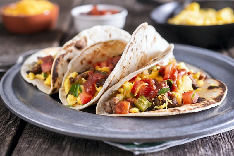 Breakfast Tacos with Eggs, Sausage, SautÃ©ed Pepper and Onion, Tomato, Salsa and Shredded Cheese