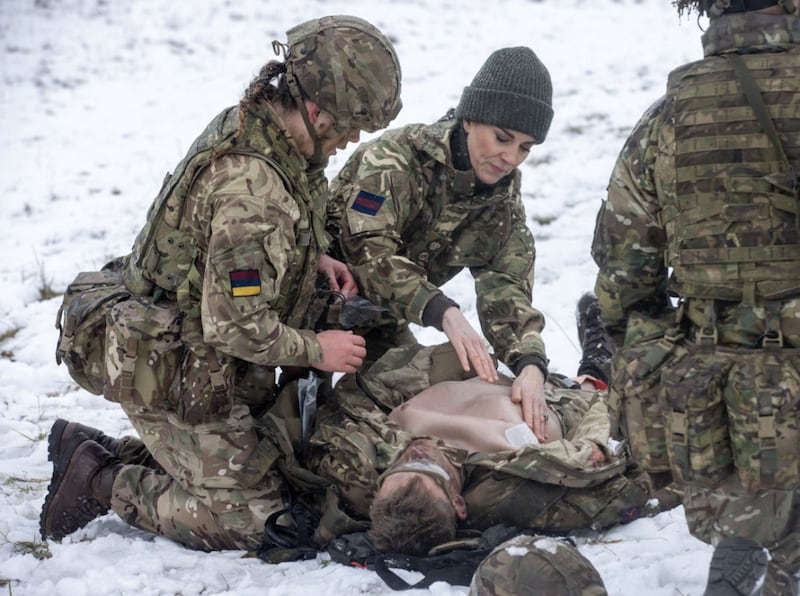 Kate, Princess of Wales is shown how to carry out battlefield casualty drills at the Salisbury Plain Training Area in Wiltshire. PA