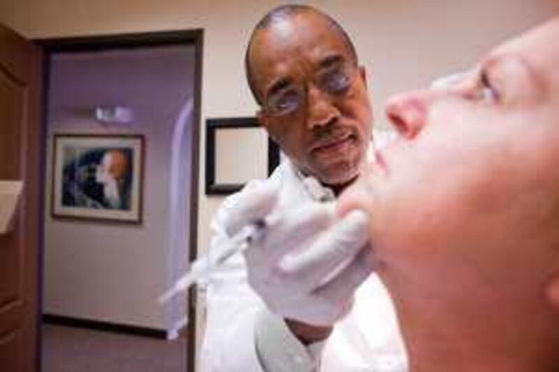 Dr. Herbert Parris, of Ageless Remedies in Denver, Colo., injects Perlane, a filler gel used to plum specifica areas of skin, into the face of Gail Kane, 49. Cosmetic injections, like the lipstick of a prior generation, are on the rise as the cash-strapped middle aged look for beauty at a lower cost. *** Local Caption ***  Botox_Effect_Parris_09.jpg