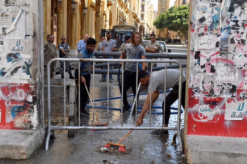 The blocks were being carted away and workers cleaned the surrounding streets. EPA