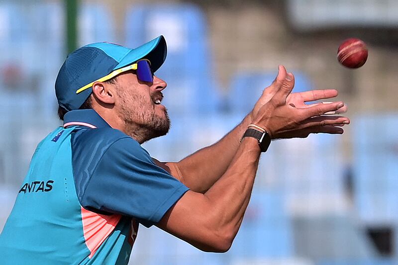 Australia's Mitchell Starc catches the ball during a practice session at the Arun Jaitley Stadium in New Delhi. AFP