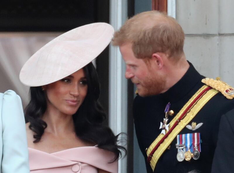LONDON, ENGLAND - JUNE 09:  Meghan, Duchess of Sussex and Prince Harry, Duke of Sussex on the balcony of Buckingham Palace during Trooping The Colour on June 9, 2018 in London, England. The annual ceremony involving over 1400 guardsmen and cavalry, is believed to have first been performed during the reign of King Charles II. The parade marks the official birthday of the Sovereign, even though the Queen's actual birthday is on April 21st.  (Photo by Chris Jackson/Getty Images)