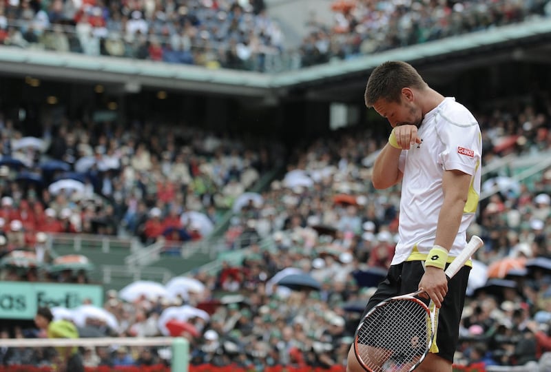 Swedish player Robin Soderling reacts to play against Swiss player Roger Federer during their French Open tennis men's final match on June 7, 2009 at Roland Garros Stadium in Paris. Roger Federer won his 14th major on June 7, 2009 with victory over  Robin Soderling in the French Open final. It was the Swiss star's  first Roland Garros title and helped him become only the sixth man to  complete a career Grand Slam. Fererer won 6/1,7/6,6/4. AFP PHOTO / LIONEL BONAVENTURE (Photo by LIONEL BONAVENTURE / AFP)