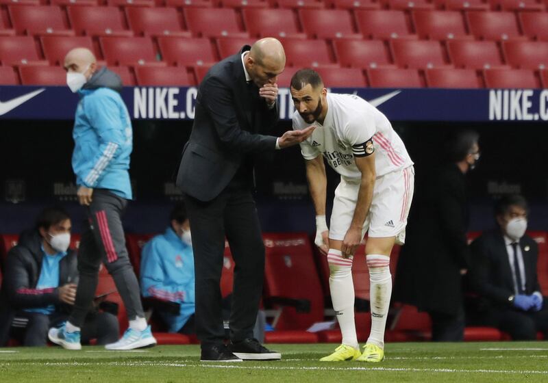 Real Madrid's Karim Benzema with coach Zinedine Zidane. Reuters