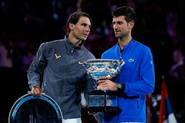 Spain's Rafael Nadal congratulates Serbia's Novak Djokovic (R) during the presentation ceremony after the men's singles final on day 14 of the Australian Open tennis tournament in Melbourne on January 27, 2019. (Photo by DAVID GRAY / AFP) / -- IMAGE RESTRICTED TO EDITORIAL USE - STRICTLY NO COMMERCIAL USE --