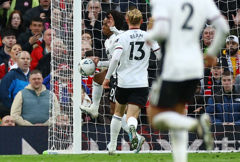 Fulham's Willian handles the ball, gives away a penalty and is sent-off. Reuters