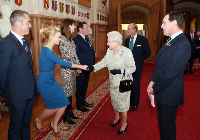 Queen Elizabeth II meets English actress Carey Mulligan at a reception celebrating the British Film Industry, in Windsor Castle, on April 4, 2013. AFP