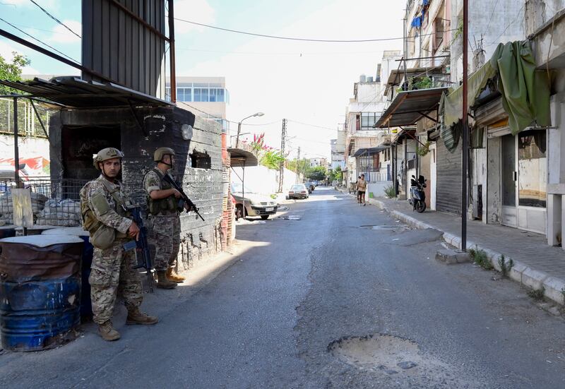 Lebanese army soldiers stand guard at Ain Al Hilweh refugee camp after bouts of heavy fighting. EPA