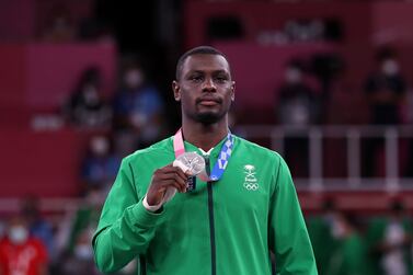 Silver medalist Tareg Hamedi of Saudi Arabia poses with his medal during the medal ceremony for the Men's Kumite +75kg during the Karate events of the Tokyo 2020 Olympic Games at the Nippon Budokan arena in Tokyo, Japan, 07 August 2021.   EPA / HEDAYATULLAH AMID