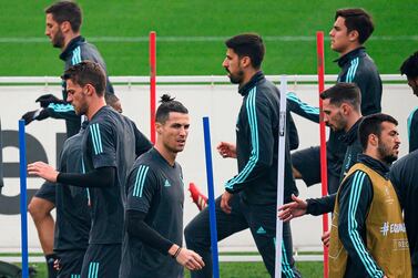 Juventus Portuguese forward Christiano Ronaldo (3rd L) attends a training session on the eve of the UEFA Champions League football match between Olympique Lyonnais and Juventus on February 25, 2020, at the Juventus Training Center in Turin. / AFP / MARCO BERTORELLO