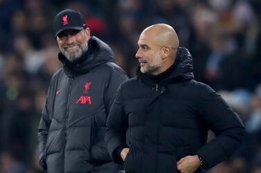 Manchester City manager Pep Guardiola and Liverpool manager Jurgen Klopp during the Carabao Cup fourth round match at the Etihad Stadium, Manchester. Picture date: Thursday December 22, 2022.