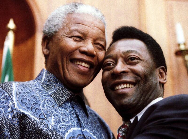 Mandela with Brazilian football legend Pele in 1995. Juda Ngwenya / Getty Images