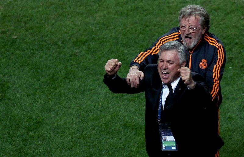 Real Madrid manager Carlo Ancelotti, left, and his assistant coach Giovanni Mauri celebrate winning the Champions League final. Andre Kosters / EPA / May 24, 2014