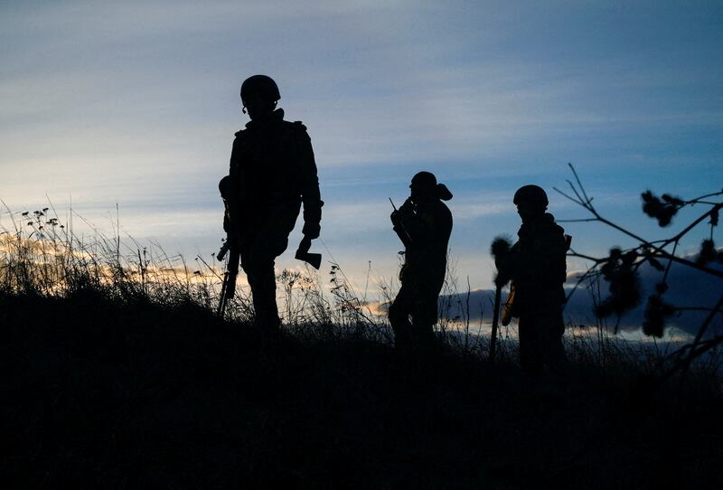 Ukrainian servicemen take positions at a military airbase in the Kyiv region. Reuters