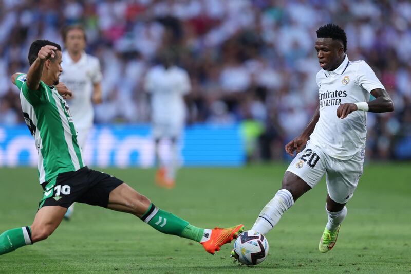 Real Betis defender Luiz Felipe tackles Real Madrid forward Vinicius Junior. AFP