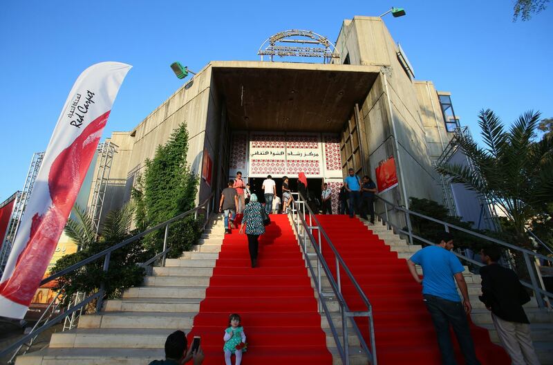 Palestinians arrive for the opening of the "Red Carpet" cinema festival in Gaza City, on May 12, 2016. - The ten cinema theatres in operation in the Gaza Strip were closed in 1987 when the first intifada broke out. In 1995, after the Palestinian Authority made its heardquarters in Gaza, half were reopened but were closed again following grenade attacks launched by radical Islamists. (Photo by MOHAMMED ABED / AFP)