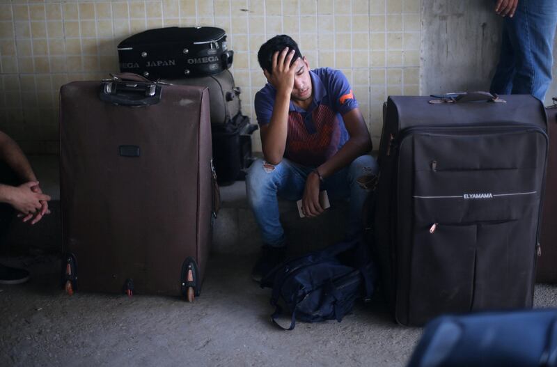A Palestinian man rests as he waits with his family for a travel permit to cross into Egypt through the Rafah border crossing after it was opened by Egyptian authorities for humanitarian cases, in Rafah in the southern Gaza Strip August 16, 2017. Ibraheem Abu Mustafa / Reuters