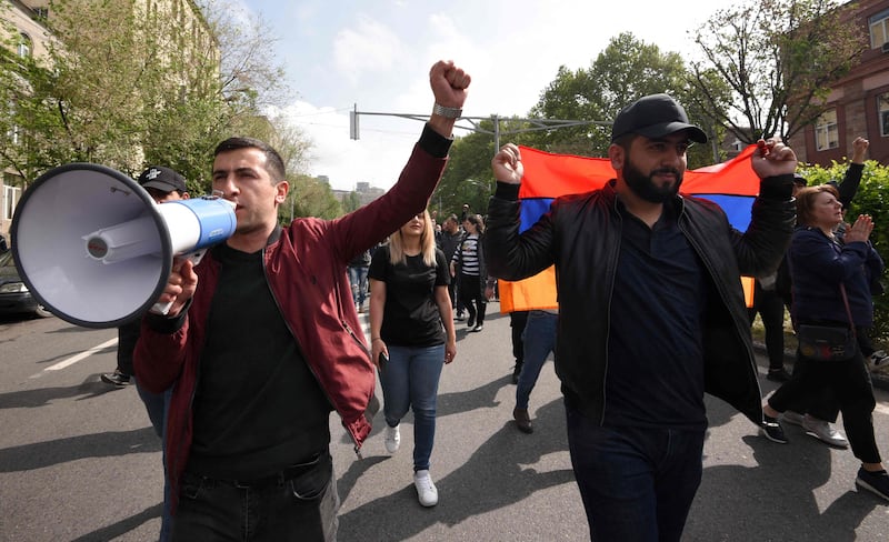 Demonstrators shout slogans as they attend the rally held to protest against the Karabakh concession. AFP