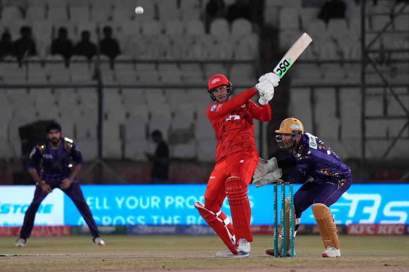 Islamabad United' Alex Hales, center, plays a shot during the Pakistan Super League T20 cricket eliminator match between Islamabad United and Quetta Gladiators, in Karachi, Pakistan, Friday, March 15, 2024.  (AP Photo / Fareed Khan)