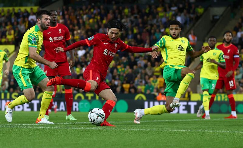 Liverpool's Japanese midfielder Takumi Minamino scores the opening goal against home side Norwich City in their Carabao Cup match on Tuesday. AFP