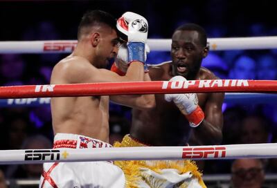 Boxing - Terence Crawford v Amir Khan - WBO World Welterweight Title - Madison Square Garden, New York, U.S. - April 20, 2019. Terence Crawford and Amir Khan in action REUTERS/Mike Segar
