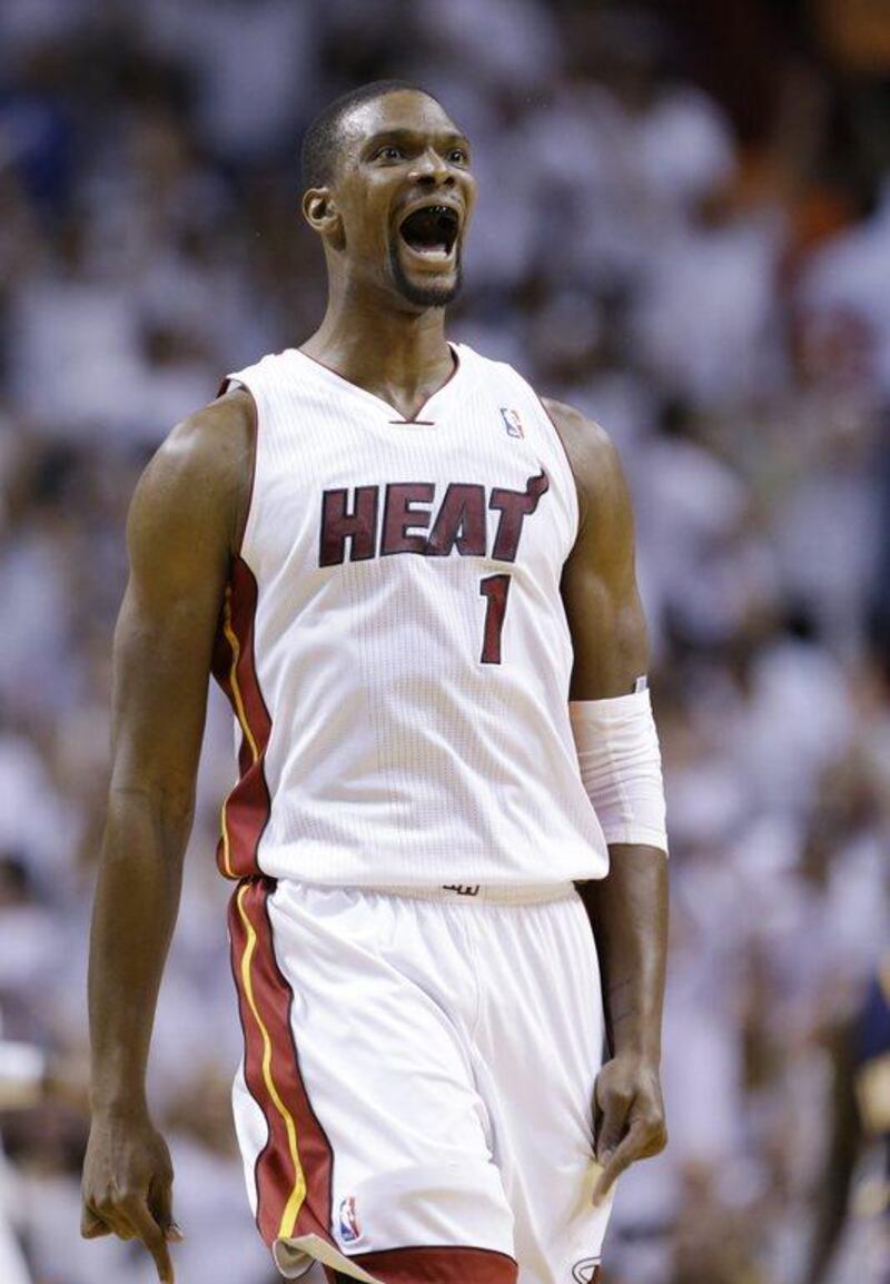 Miami Heat centre Chris Bosh reacts during Game 4 of the Eastern Conference finals on Monday night. Wilfredo Lee / AP / May 26, 2014 