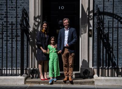 Nazanin Zaghari-Ratcliffe, her daughter Gabriella and her husband Richard Ratcliffe stand on the doorstep at 10 Downing Street in May. Getty Images