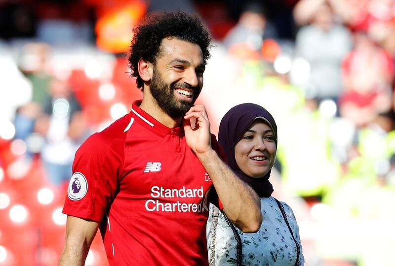 Soccer Football - Premier League - Liverpool v Wolverhampton Wanderers - Anfield, Liverpool, Britain - May 12, 2019  Liverpool's Mohamed Salah walks around the pitch alongside his wife, Magi Salah, after the match  REUTERS/Phil Noble  EDITORIAL USE ONLY. No use with unauthorized audio, video, data, fixture lists, club/league logos or "live" services. Online in-match use limited to 75 images, no video emulation. No use in betting, games or single club/league/player publications.  Please contact your account representative for further details.