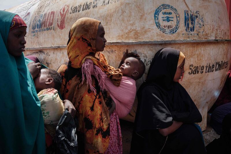 Mothers wait for food and health services in a camp for internally displaced persons in Baidoa, Somalia, on February 14, 2022. Insufficient rainfall since late 2020 has come as a fatal blow to populations already suffering from a locust invasion between 2019 and 2021 and the Covid-19 pandemic. AFP