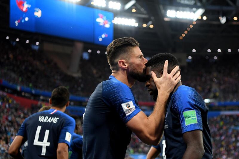 France's Samuel Umtiti celebrates with teammate Olivier Giroud after scoring his team's first goal. Getty Images