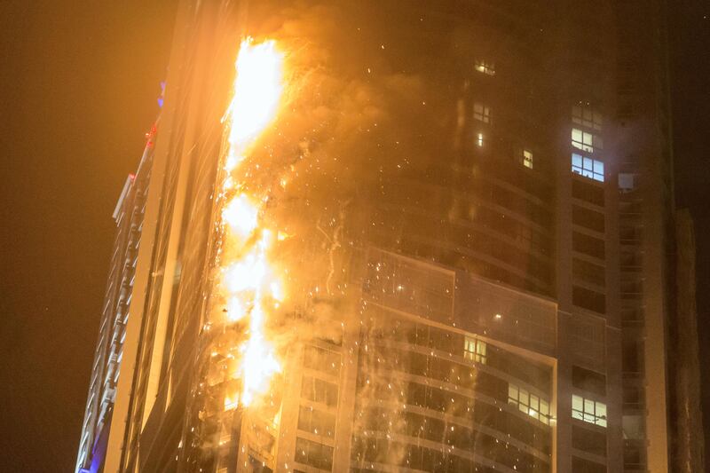 DUBAI. UNITED ARAB EMIRATES, 04 AUGUST 2017. A massive fire rips through The Marina Torch tower's southern corner. (Photo: Antonie Robertson) Journalist: None. Section: National.