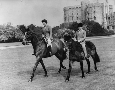 After the televised coronation, the royal family, encouraged by Prince Philip, began letting the media in more, such as capturing this photo of Queen Elizabeth II and Prince Charles riding at Windsor Castle in May 1961. PA