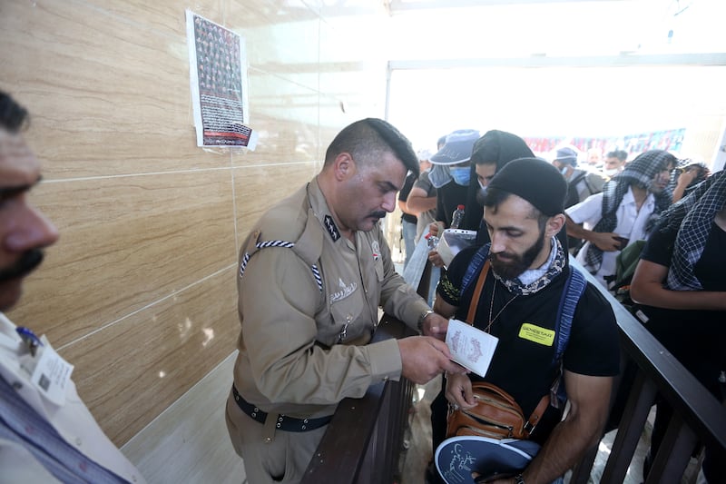 Iranian Shiite pilgrims cross the border into Iraq as they head to Karbala to attend Arbaeen. EPA