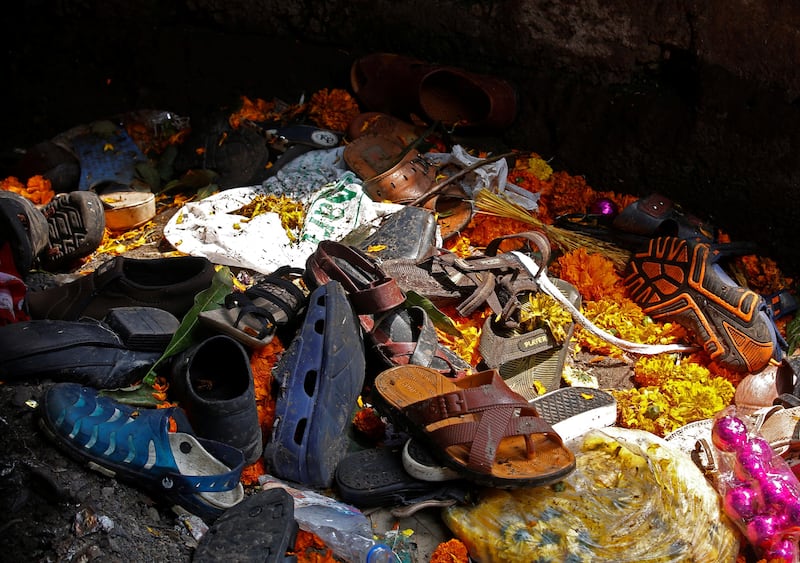 Footwear of the victims of a stampede are seen below a railway station's pedestrian overbridge in Mumbai, India. Shailesh Andrade / Reuters