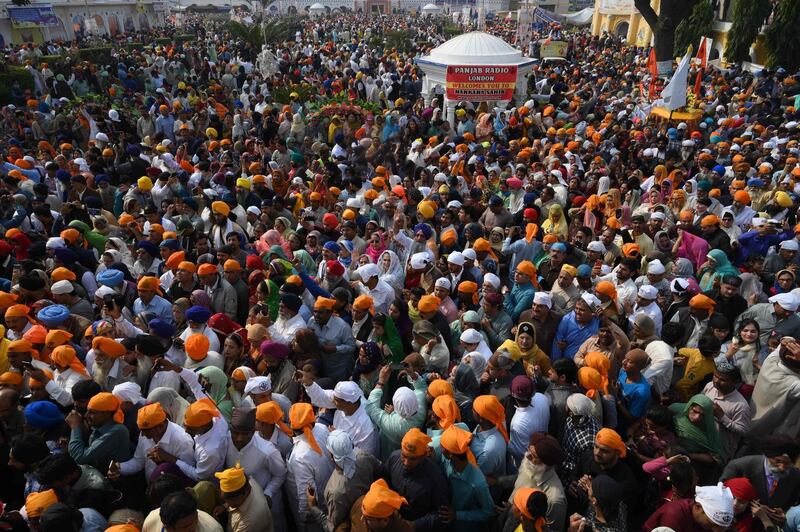Sikh pilgrims gather to celebrate the 550th birth anniversary of Guru Nanak Dev, at Nankana Sahib, a Pakistani city about 80 kilometres from the eastern city of Lahore on November 12, 2019. The celebration to mark the 550th birth anniversary of Sikhism's founder the Guru Nanak has been given extra significance this year with the opening of the Kartarpur Corridor, a secure, visa-free passage between arch-rivals India and Pakistan that gives Indian Sikhs access to the place where the guru died in 1539, now one of the religion's holiest sites.
 AFP