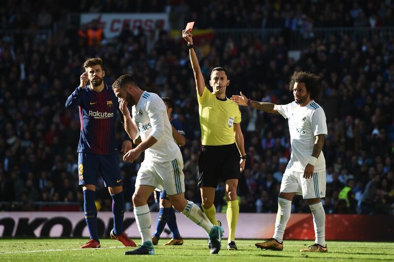 MADRID, SPAIN - DECEMBER 23: Daniel Carvajal of Real Madrid is shown a red card by referee Jose Maria Sanchez during the La Liga match between Real Madrid and Barcelona at Estadio Santiago Bernabeu on December 23, 2017 in Madrid, Spain.  (Photo by Denis Doyle/Getty Images)