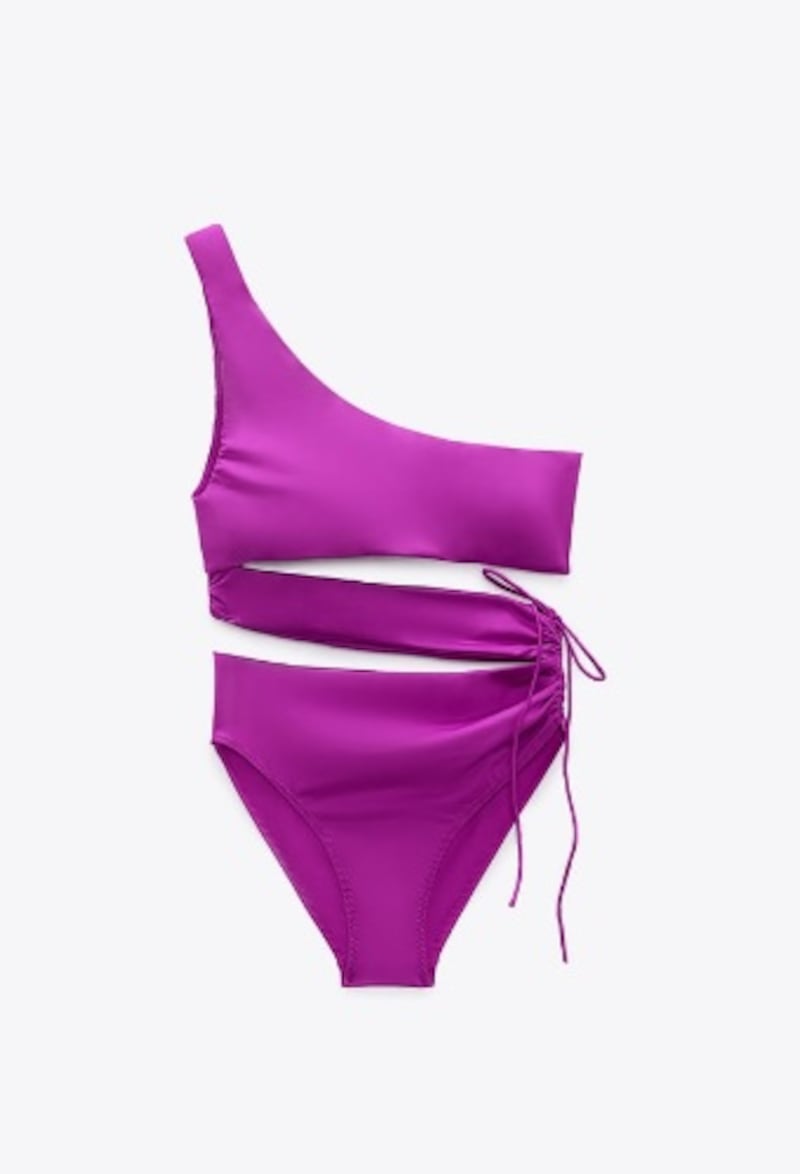 The rich and luxurious magenta colour will make you stand out at any pool or beach get-together in this Zara one-piece that features midriff cut-outs and a side tie; Dh219, zara.com. Photo: Zara