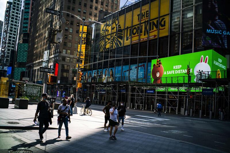 People walk around New York's Times Square in the US. Getty Images