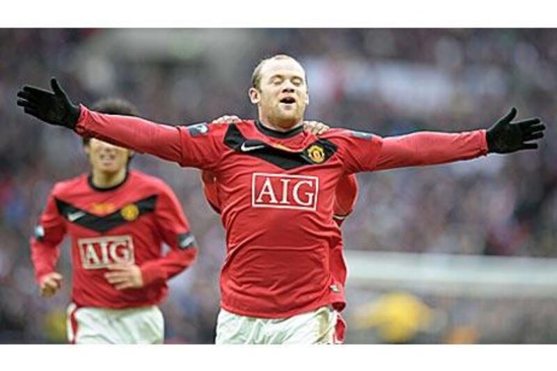 Wayne Rooney celebrates scoring Manchester United's winner, after coming off the bench, to beat Aston Villa 2-1 in the Carling Cup Final at Wembley, London.