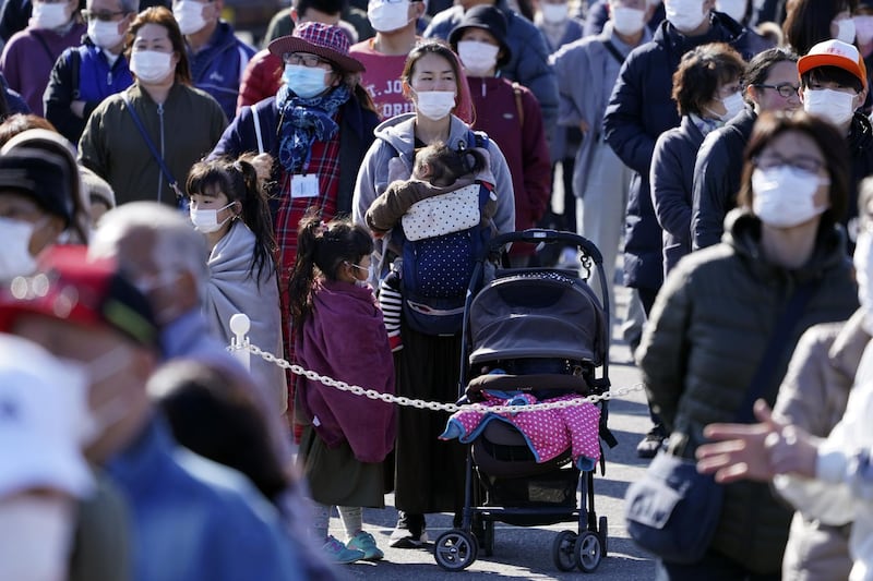 Spectators wait to see the  Olympic flame display ceremony. AP