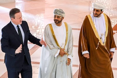 Omani Foreign Minister Sayyid Badr Al Busaidi receives Britain's Foreign Secretary David Cameron in Muscat on January 31.  AFP