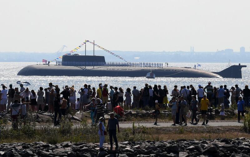 People look at nuclear submarine "Orel" participating in the Navy Day parade at Kronshtadt near Saint Petersburg.   AFP / OLGA MALTSEVA