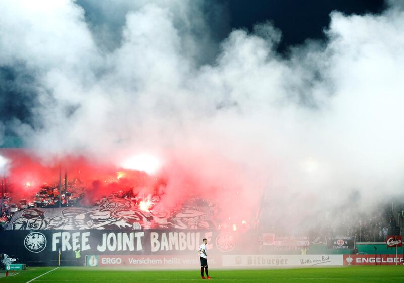 Flares and smoke bombs are set off during FC Heidenheim and Eintracht Frankfurt's German Cup tie. Ralph Orlowski / Reuters