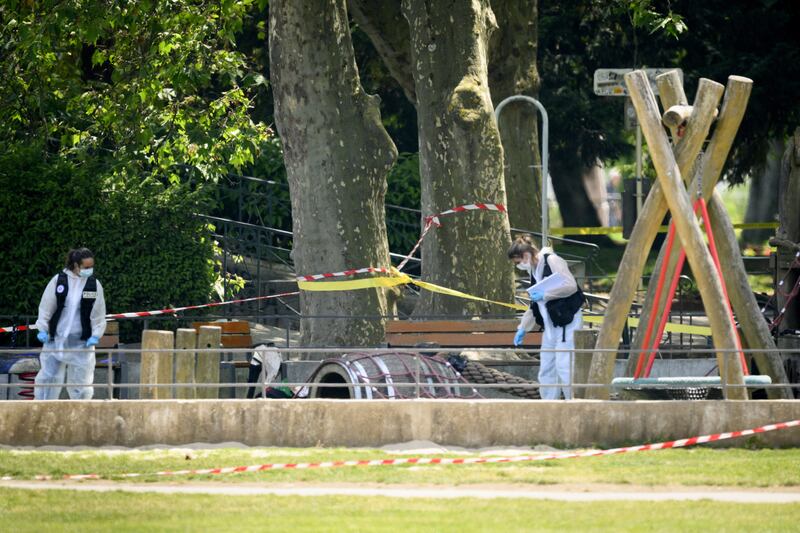 Police officers inside a cordoned-off area in Annecy. EPA