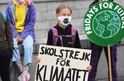 epa08645348 Swedish climate activist Greta Thunberg holds a poster reading 'School strike for Climate' as she protests in front of the Parliament Riksdagen, Sweden, 04 September 2020.  EPA/Fredrik Sandberg  SWEDEN OUT